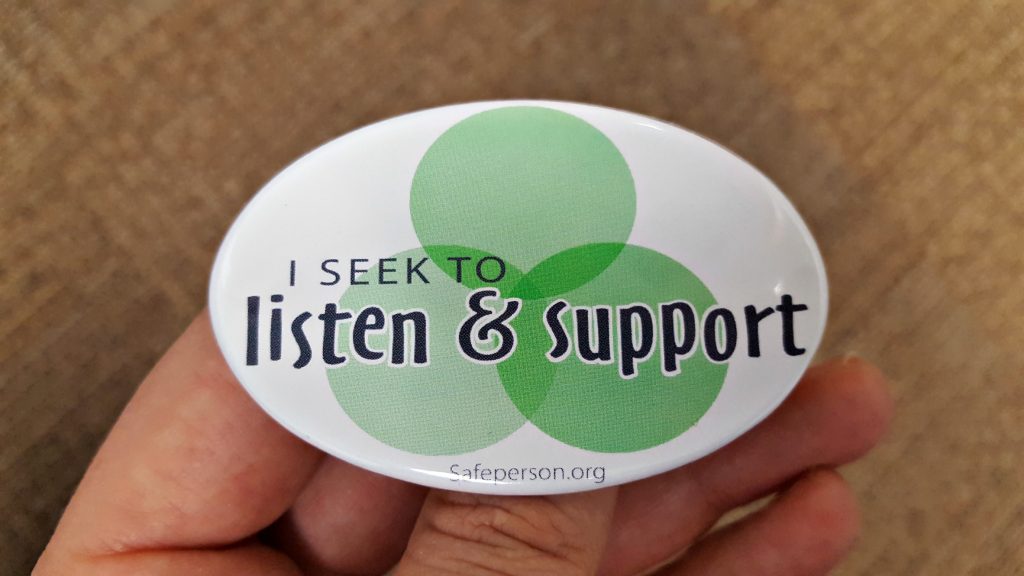 A decal titled 'The Safe Person 7 Promises' displaying the text 'I seek to listen & support', accented by overlaying green circles in the background.