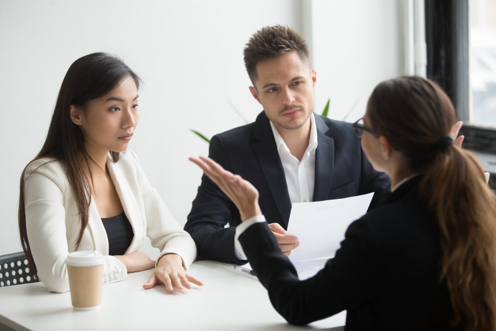 Skeptical unconvinced HR managers interviewing an applicant feeling distrustful and doubtful.
